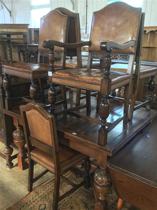 Oak dining suite, inc drawleaf table on bulbous supports, six studded hide covered chairs (2 with arms) & a carved sideboard